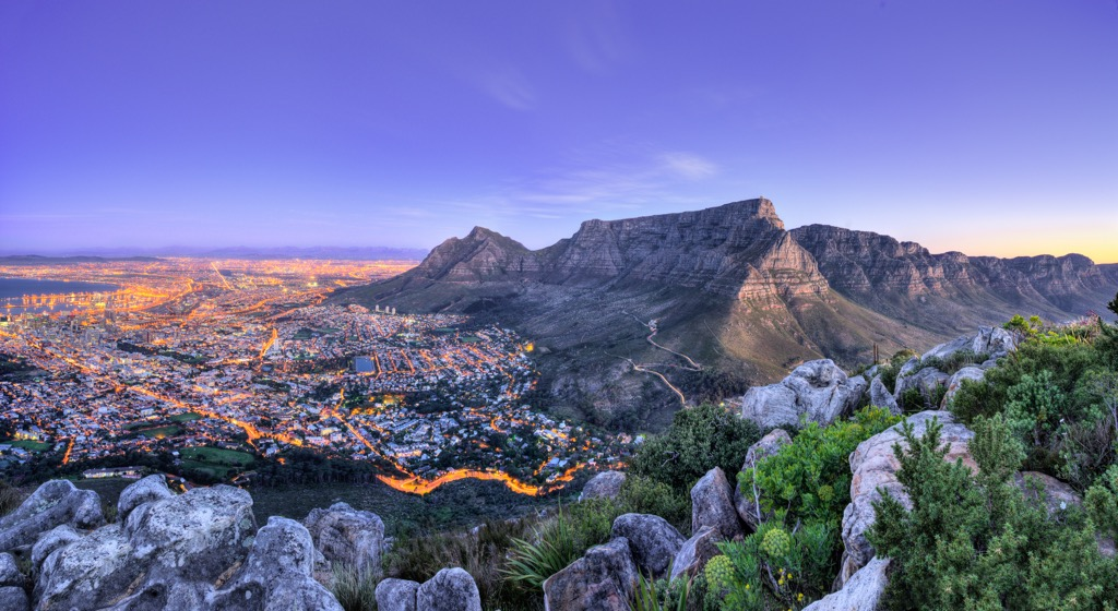 Table Mountain and the Cape Town city bowl glowing at dusk